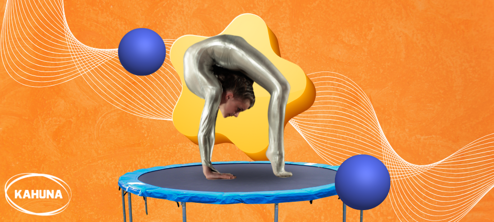 Acrobat bending on a mini trampoline