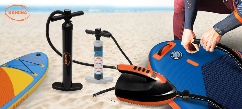 Manual and Electric Kahuna SUP Pumps next to Paddle boards