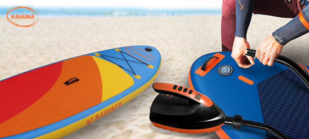 Paddle boarder inflating their iSUP with a manual and electric pump