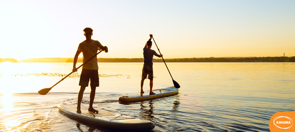 Paddle boarding with a friend at sunset 