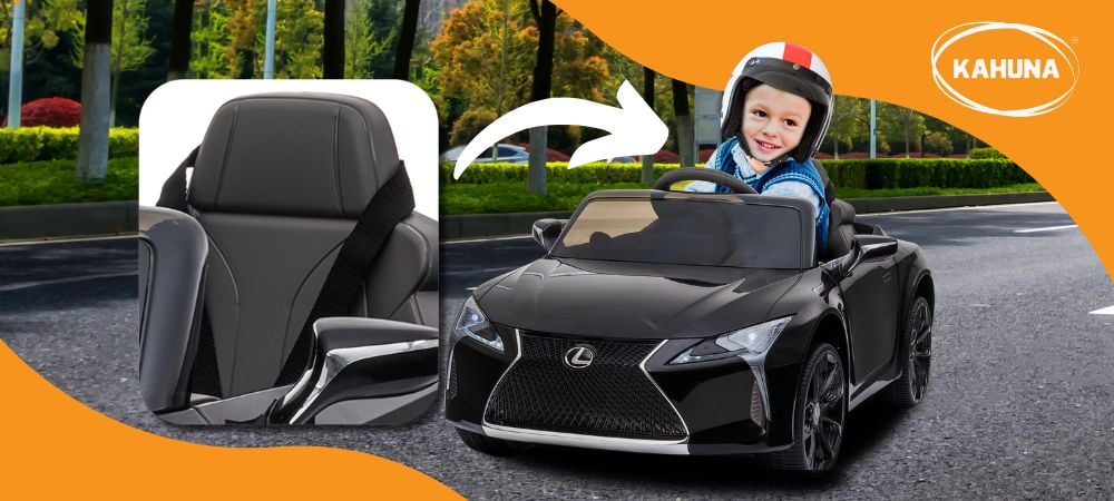 A young boy in a yellow ride on car driving with a helmet on