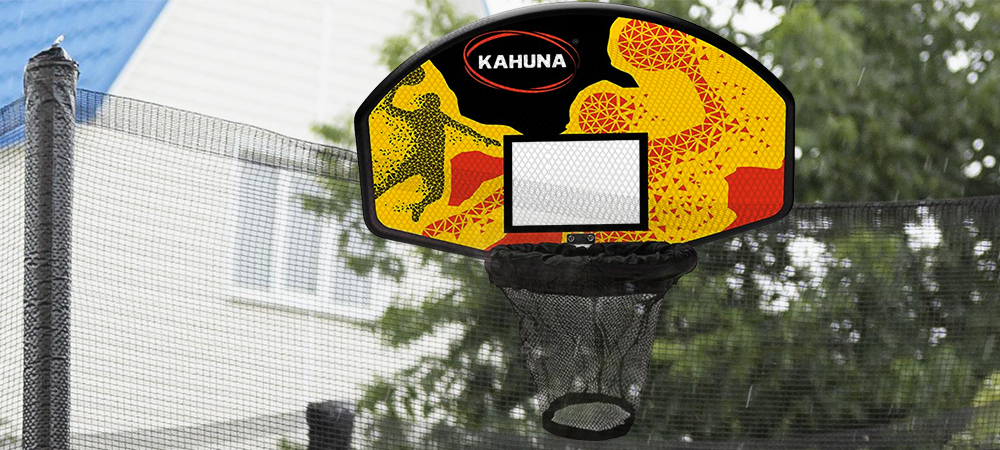 Lifestyle image showing a trampoline with a basketball kit