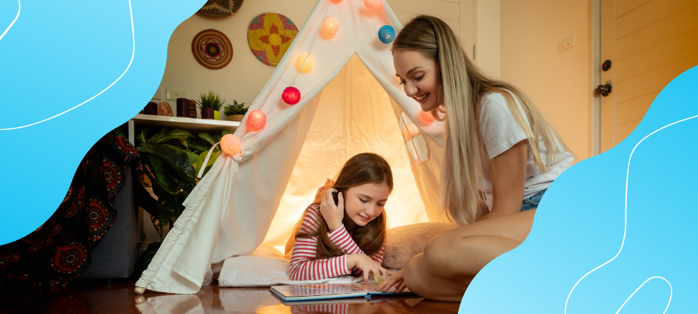 A young girl and her mom camping indoors