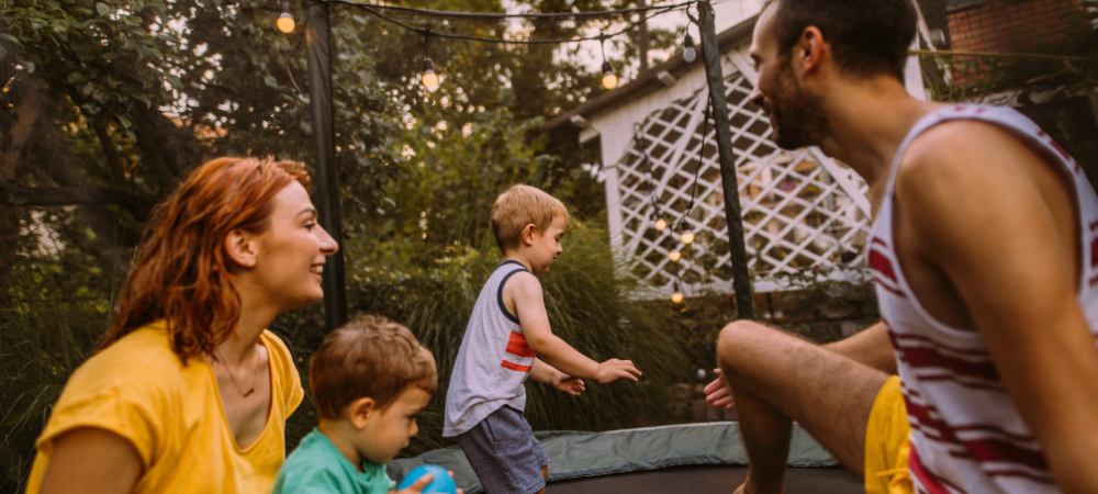 Young family checking their trampoline