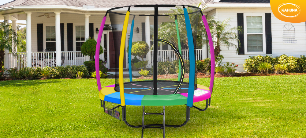 A Kahuna rainbow high-quality trampoline in a yard