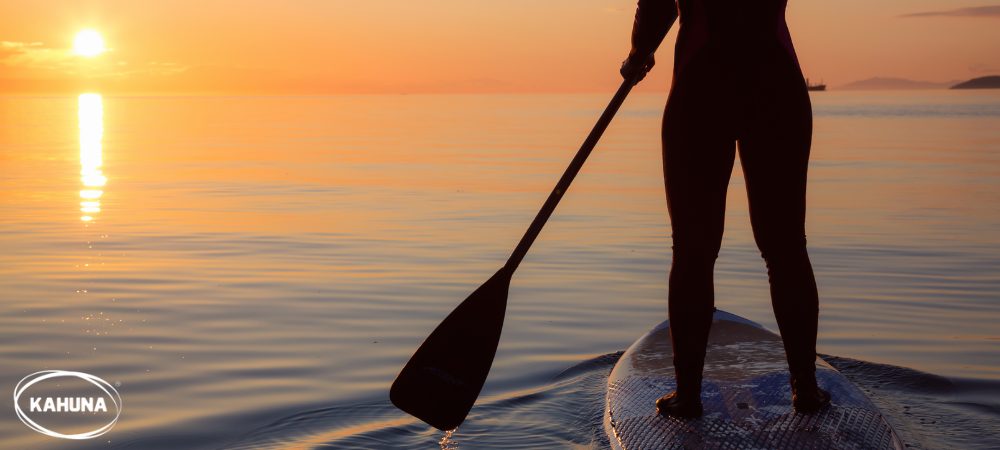 Stand up paddle boarding during sunset