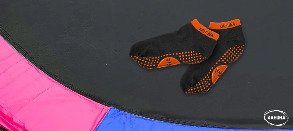 A pair of Kahuna trampoline socks on a Kahuna jump mat