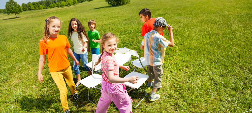 Kids playing Musical Chairs outdoors